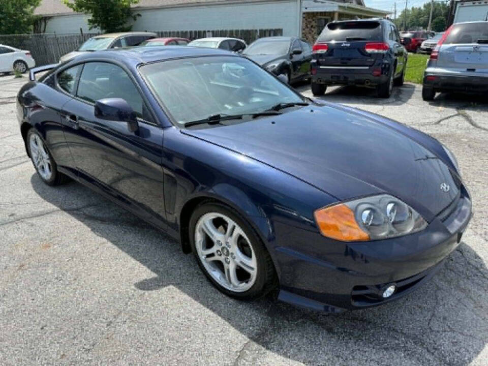 hyundai tiburon 2004 KMHHN65F84U138769 image hyundai tiburon 2004 KMHHN65F84U138769 image