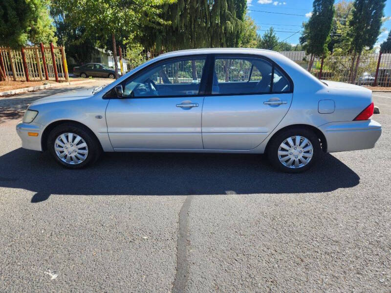 mitsubishi lancer 2003 JA3AJ26E43U069642 image mitsubishi lancer 2003 JA3AJ26E43U069642 image