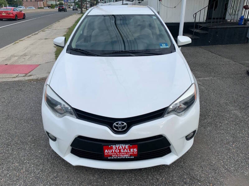 toyota corolla 2014 5YFBPRHE6EP070950 image toyota corolla 2014 5YFBPRHE6EP070950 image